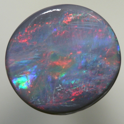 SOLID SEMI BLACK OPAL bright red moves over ocean blue green SEE VIDEO
